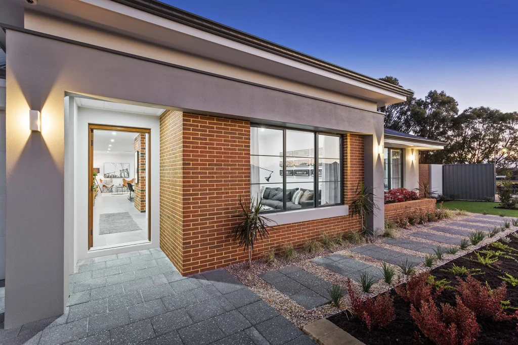 Modern brick house exterior at sunset