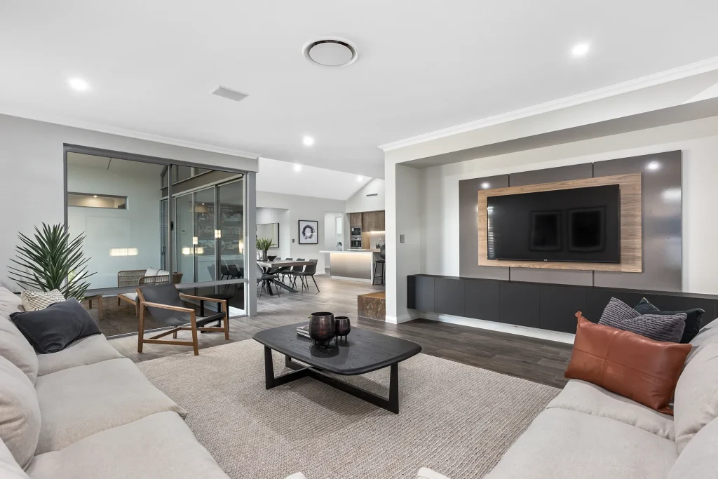 Modern living room with television wall and open dining area