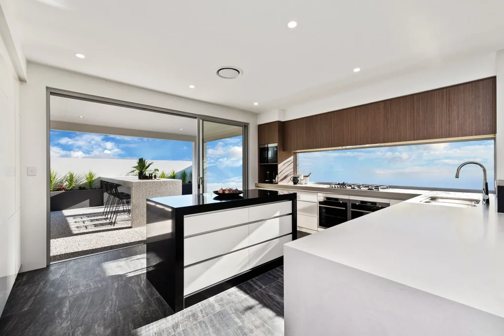 Modern kitchen with ocean view and outdoor dining area