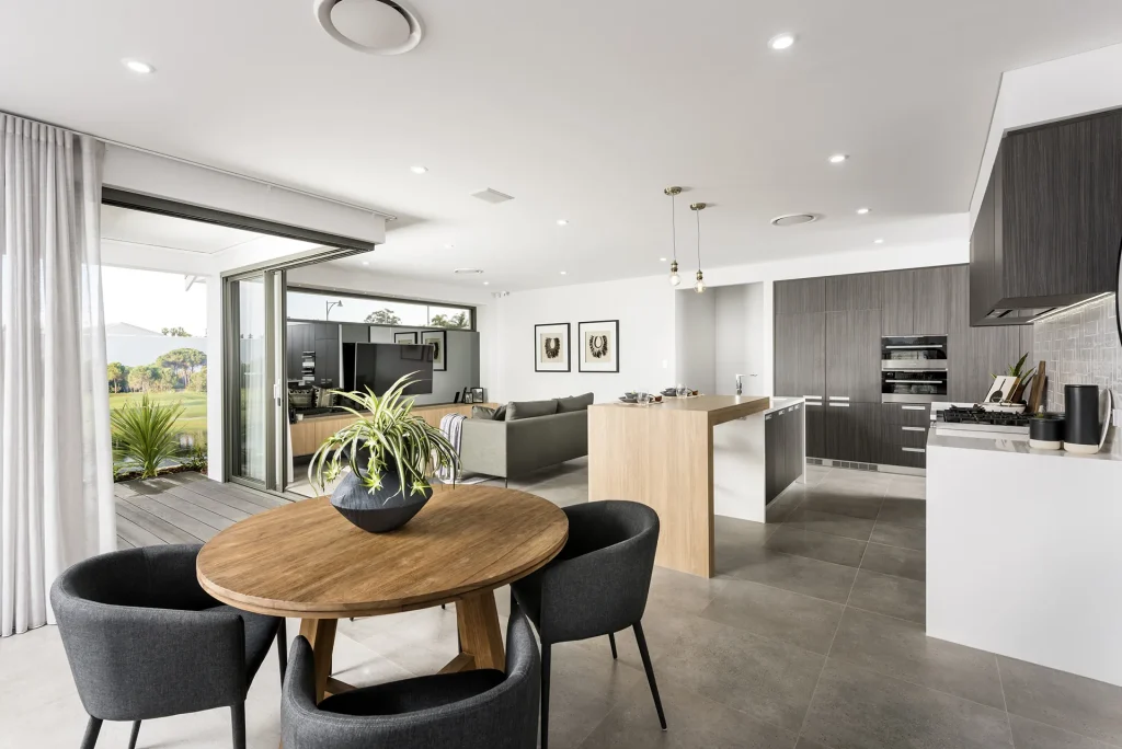 Modern open-plan kitchen, dining and living area with garden view