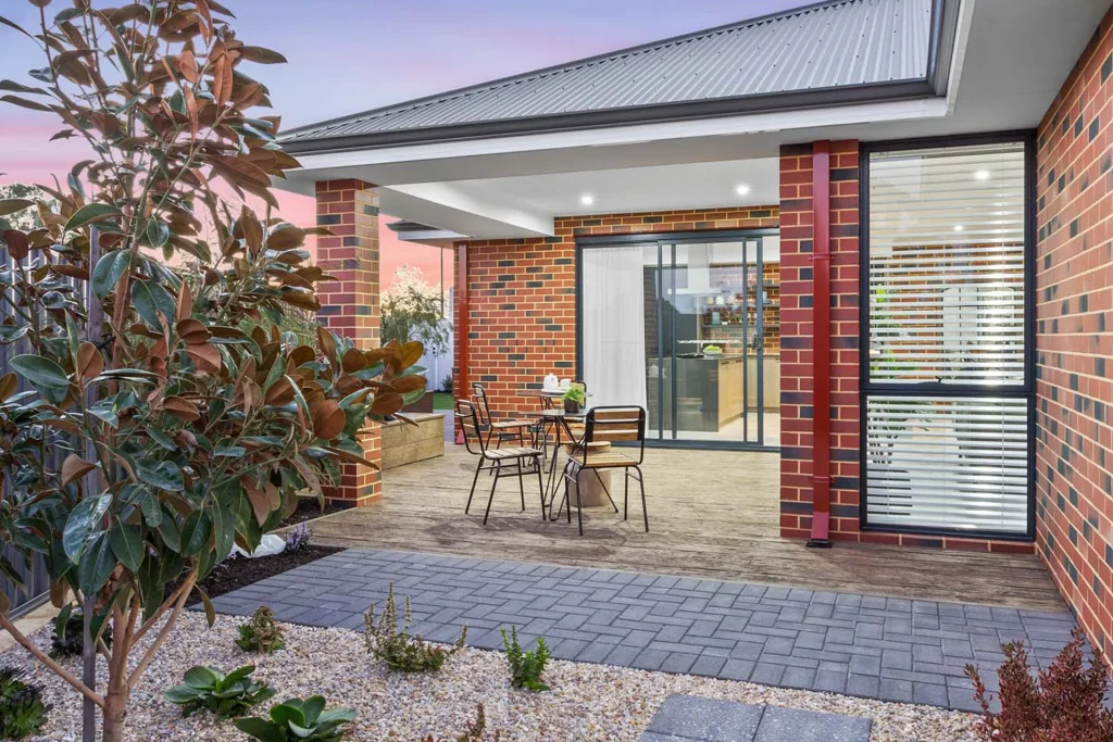 Modern brick patio with outdoor dining area