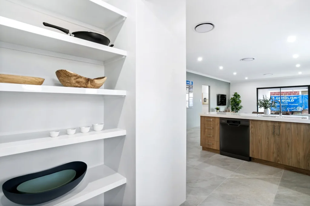 Open pantry beside modern timber kitchen island